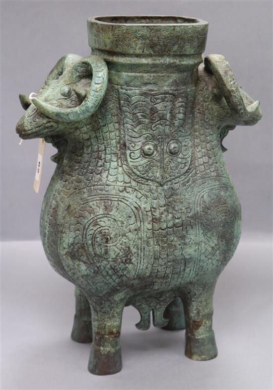 A double rams head copper zun/ritual wine vessel, after the Shang dynasty original in the British Museum height 42cm